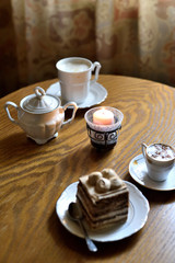 Set table in cafe with coffee and cake