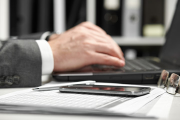 Businessman working in an office. Hands closeup.