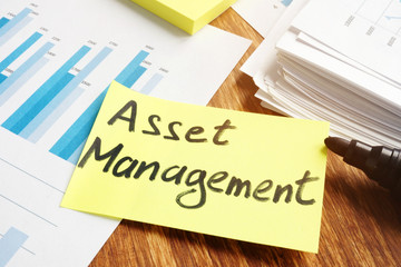 Asset management concept. Stack of business papers.