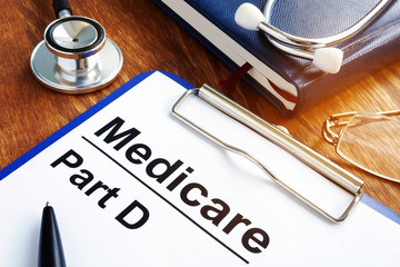Medicare Part D documents with clipboard on a desk. - obrazy, fototapety, plakaty