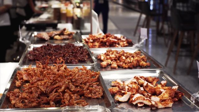 Delicious roasted seafood in trays in thai food court