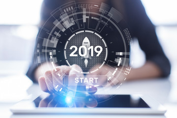 New year 2019 start button on virtual screen hologram. FInancial growth and new perspective in business and life.