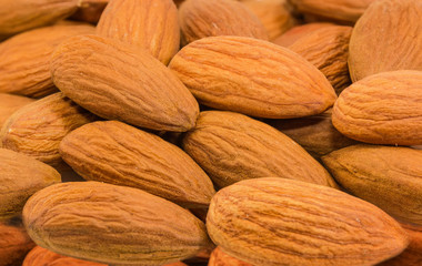 Background of the almonds peeled from shells close-up