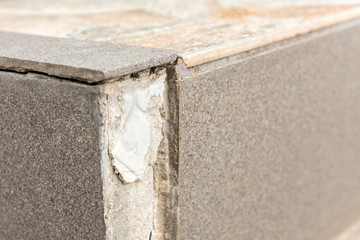 Damaged tile on steps. 