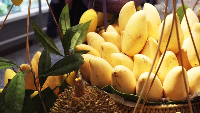 Tasty yellow mango and durian in Bangkok market, Thailand
