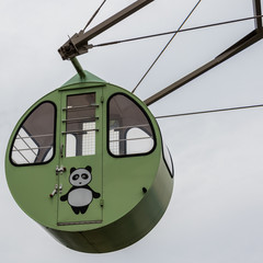 Detail view on a round, colorful Ferris Wheel Cabin with painted panda bear. Located in Amanohashidate View Land, Miyazu, Japan, Asia.