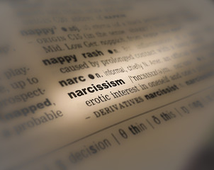Fototapeta premium A close up of the a dictionary page showing the highlighted word: narcissism