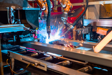 Welding robot welds metal parts.