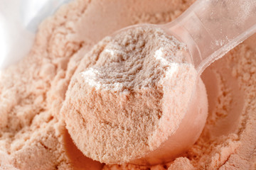 Whey protein scoop. Close-up sports nutrition.