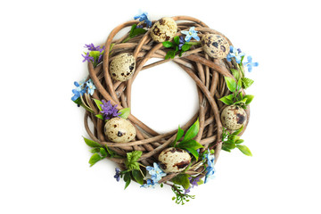 decorative bird's nest with flowers and quail eggs