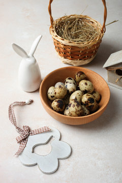 quail eggs, decorative Easter bunny and basket
