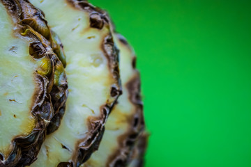 Tropical citrus fruit the pineapple cut on rings on a green background. Healthy food. Exotic of summer