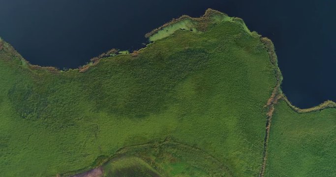 Bird's eye view going from land to river