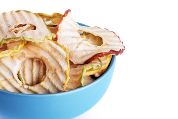 Bowl with apple chips isolated on white background.
