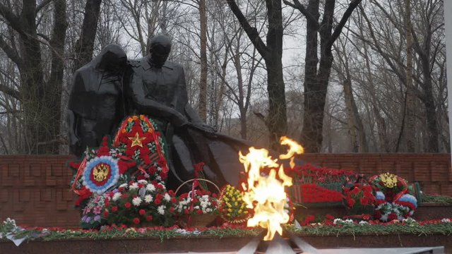 Victory Memorial to Soviet Army in Russia. Day, rain, may. Eternal flame. Wide shot