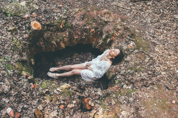 Beautiful brunette girl posing on earth