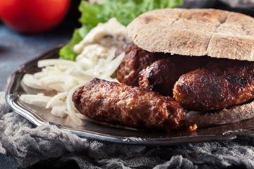 Cevapcici or cevapi served with lepinja bread