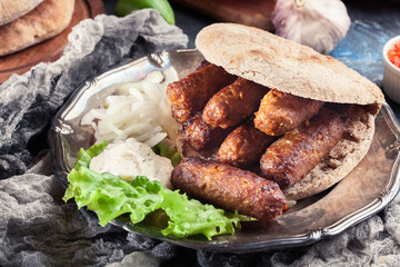 Cevapcici or cevapi served with lepinja bread