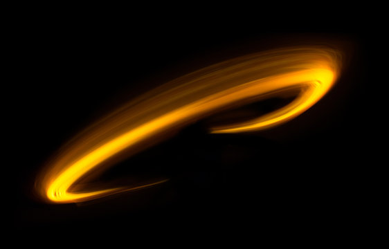 Glowing Shiny Curve Light Trail Lines Effect In Black Background.