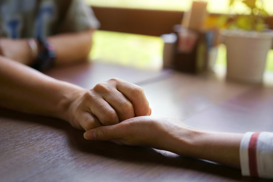 Love Concept, Close Up, Woman And Man Holding Hands Take Care Together.