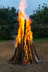 Outdoor camp fire burning at blue hour or twilight