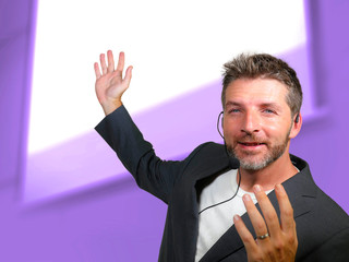 confident successful man with headset speaking at corporate business coaching and training...