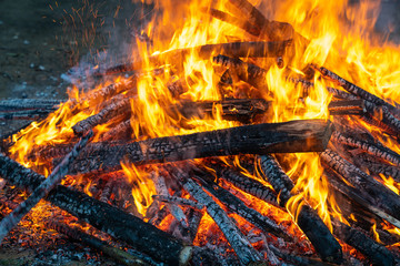 Outdoor camp fire burning at blue hour or twilight