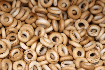 Dry bagels heap, selective focus. Background for bakery, food store