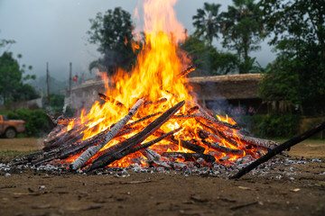 Outdoor camp fire burning at blue hour or twilight