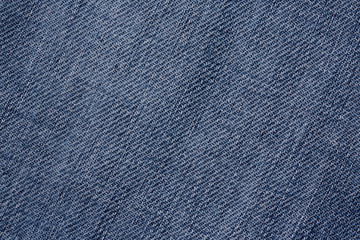 Naklejka premium Texture of old blue jeans for background.