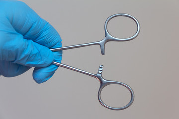 medical clip in surgeon's hand