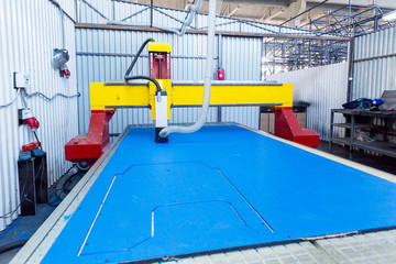 milling machine cuts plastic in production