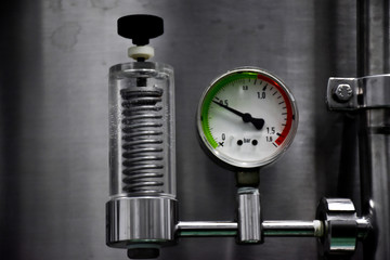 Close up gas pressure meter tubes valves