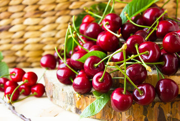 red ripe  fresh cherries on wooden  sack background.  Garden fresh organic cherries . Food background.