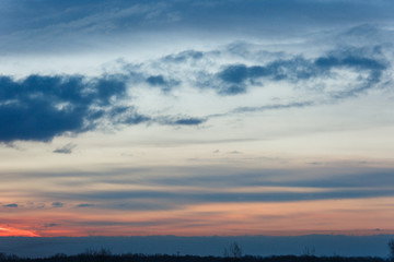Beautiful winter dawn. Sunlight through the clouds in the morning in winter.