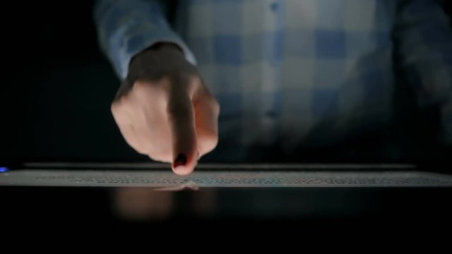 Woman using interactive touchscreen display of electronic multimedia kiosk at modern history museum - close up shot. Education, learning and technology concept