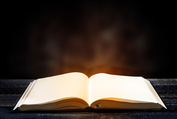 Quran open on wooden table
