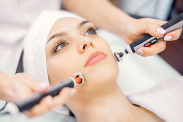 Cosmetology. Close-up of hardware wrinkle smoothing procedure.