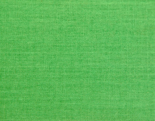 Textured background of green natural textile    