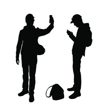 Silhouettes of a teenager taking pictures of himself on a smartphone sending a message, black color, isolated on a white background