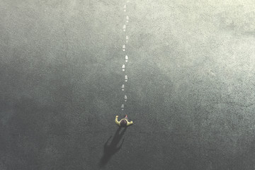 man following mysterious footsteps on the street