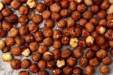 Hazelnut Background. Heap of peeled hazelnuts