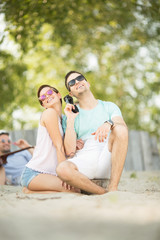 Young happy couple at the beach
