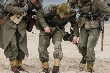 INJURED GERMAN SOLDIER - Staging the battle of the Second World War