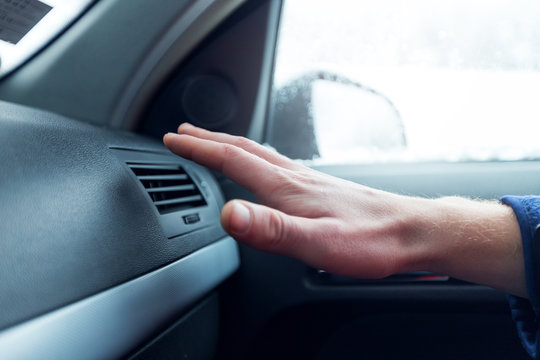 Male Hand Checking The Air Conditioner In The Car