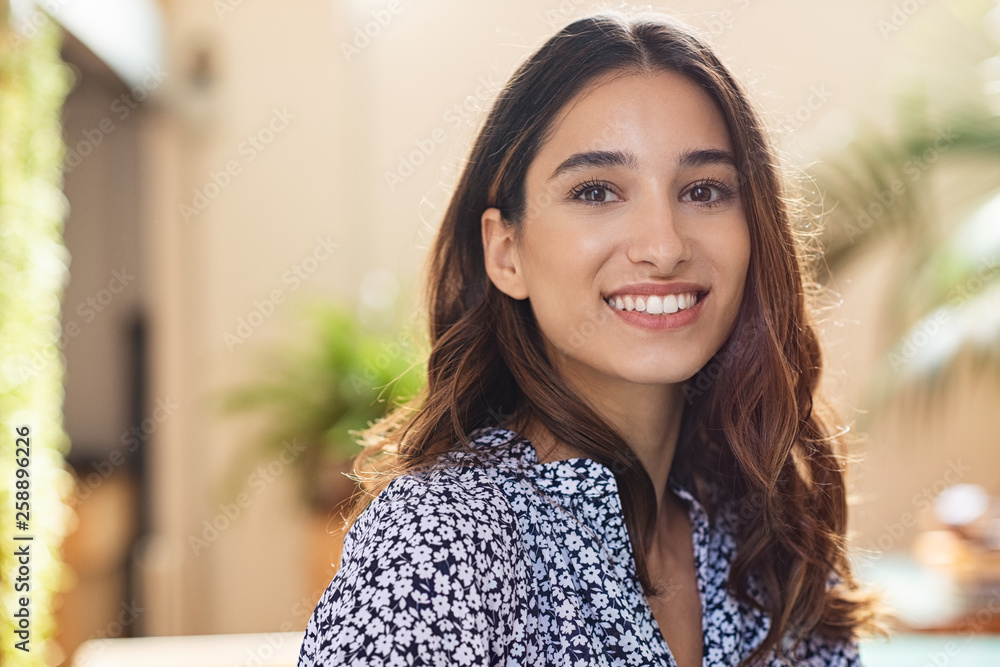 Wall mural happy young woman smiling