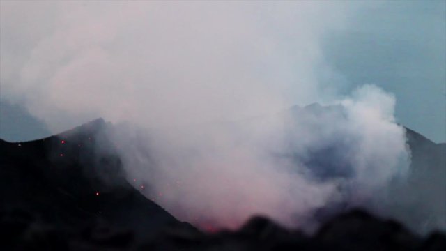 Close up of a Volcano mouth smoking after strombolian lava eruption