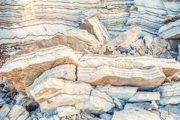 clay shores of the dead sea. The medical clay is layers and is washed with salty water
