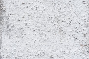 Wall fragment with scratches and cracks