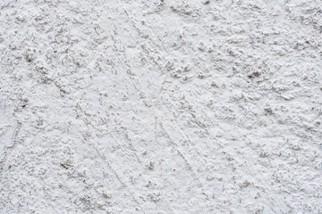 Wall fragment with scratches and cracks